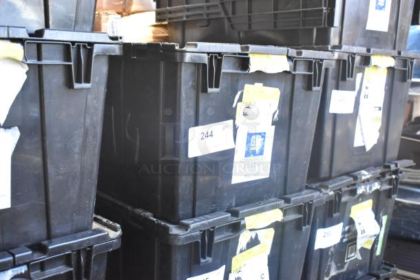 Black poly bin containing various brand new car parts, including car mats. Labels indicate organizational details.