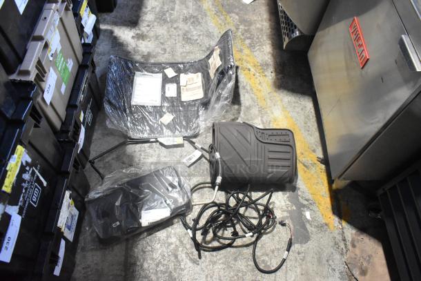 Brand new car parts, including car mats, in black poly bin. Items have labels with product details and codes visible.