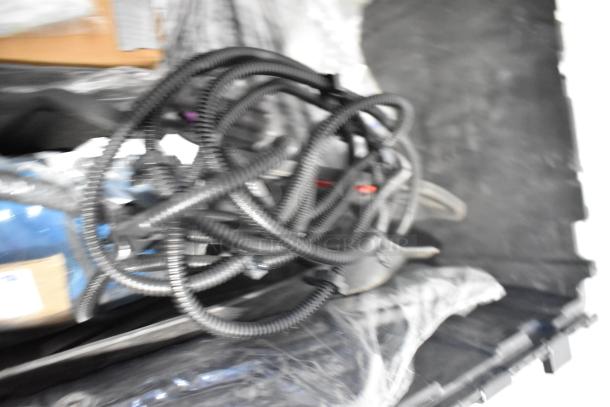 Lot of new car parts including GM 84044906 brake deflector, handle, in black poly bin.