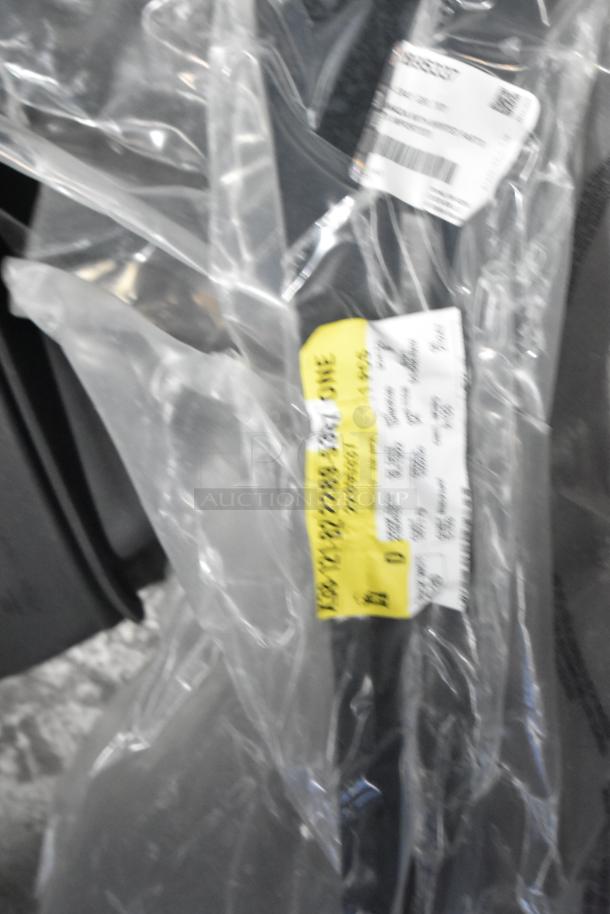 Lot of various car parts, including car mats, packaged in a clear bag with yellow labels, in a black poly bin. Brand new condition.