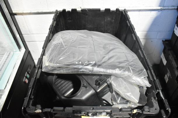 Brand new car parts and black car mats in a black poly bin, unopened and in excellent condition.
