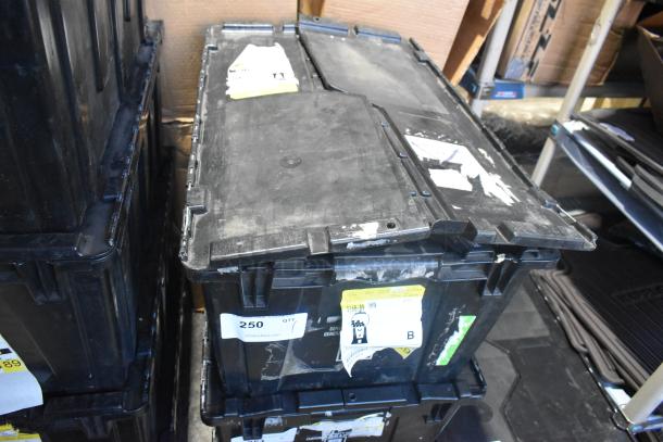Black poly bin containing brand new assorted car parts, including car mats; visible labels with auction details.