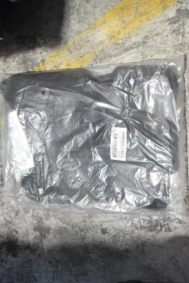 Brand new black car mats packaged in clear plastic with barcode label, part of a lot of various car parts.
