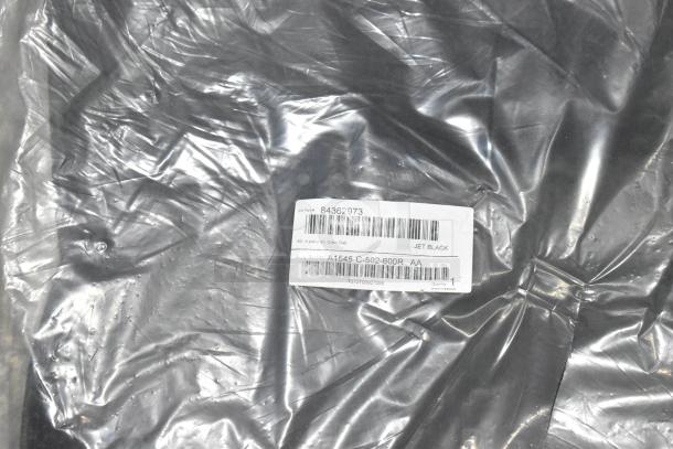 Brand new black car mats in poly bin, GM part #84362973, 4-piece kit for Crew Cab, labeled "Jet Black."