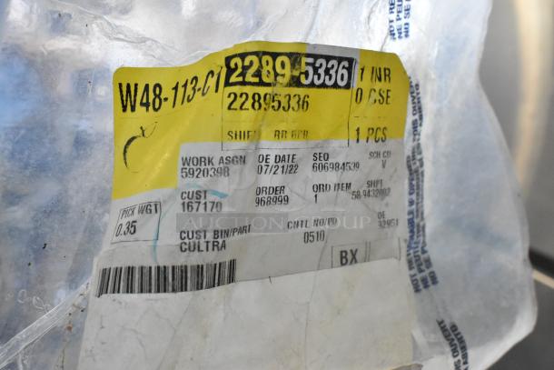 Clear plastic bag with yellow label displaying part number 22895336, work assignment 5920398, and order 968999.