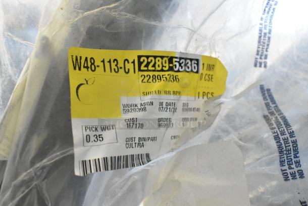 Lot of brand new car parts in a black poly bin. Visible label showing part number 2289-5336 and details like work assignment.