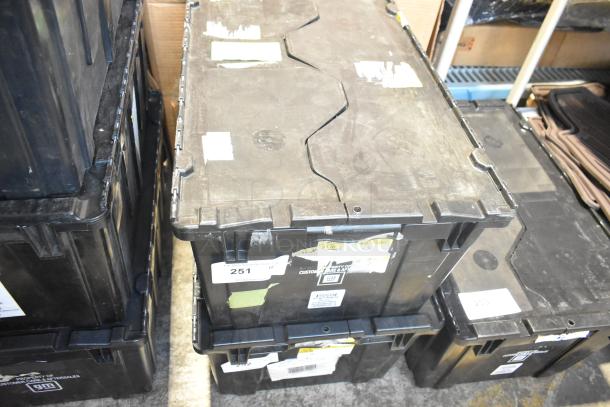 Black poly bin containing various brand new car parts, including a side view mirror. Labels show item number 251.