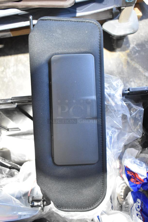 Brand new lot of various car parts in black poly bin, includes filters and panels, visible packaging intact.