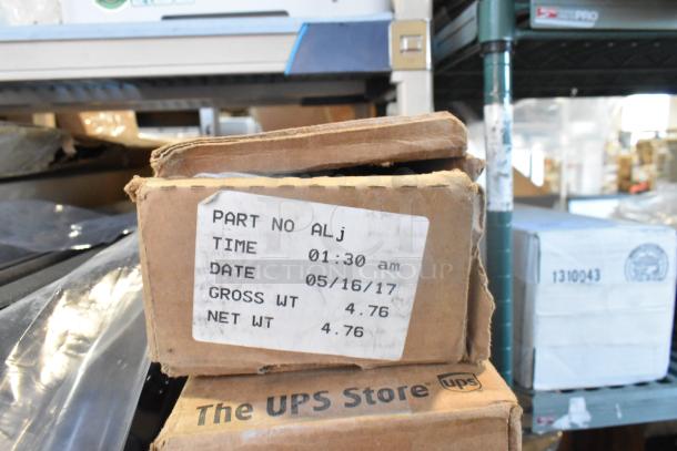 Brand new car parts lot including GM 20862098 mirror assembly. Box labeled with date 05/16/17, gross and net weight 4.76.