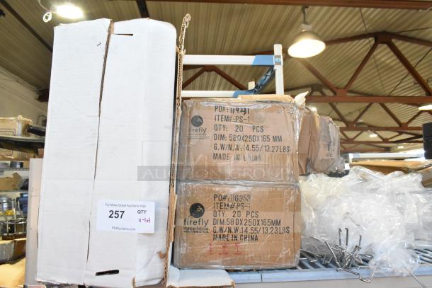 Lot of new items including Uline S-1717 strapping and Firefly PS-1, boxed and labeled, 20 pcs per box.