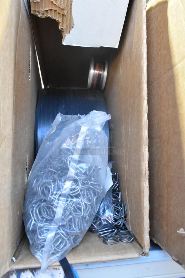 Box containing new Uline S-1717 polypropylene strapping, metal fasteners, and Firefly PS-1. Ideal for packaging needs.