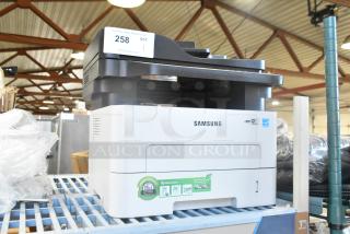 Samsung Xpress M2885FW printer, scanner, copier in good condition. Features BLI award and eco-friendly toner labels.