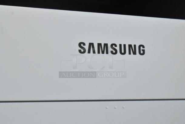 Samsung Xpress M2885FW printer; sleek design, reliable multifunction countertop unit for printing, scanning, copying.