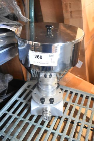Stainless steel metal hopper with a polished finish, cylindrical shape, and a labeled auction tag indicating item 260.
