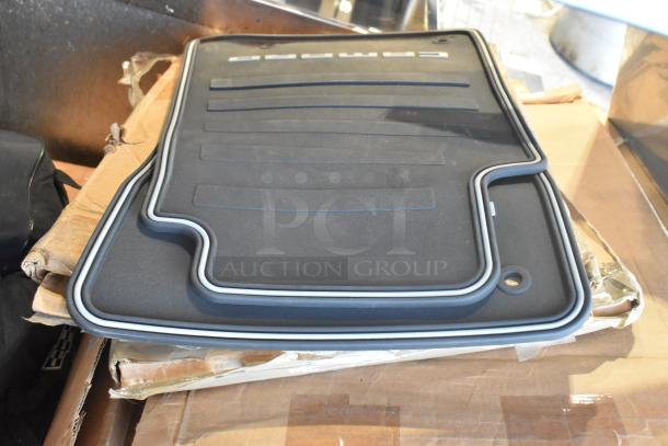 Brand new two-tier lot with car mats, featuring "Camaro" branding. Perfect condition, packaged on cardboard box.