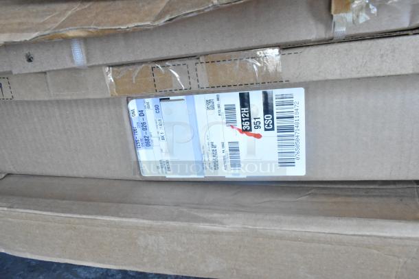 Two-tier lot of brand new items in boxes, including car mats. Labels show item codes and shipping details.