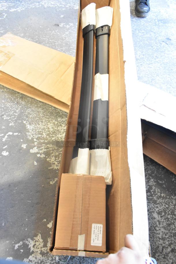 Box containing brand new rails, wrapped and secured, with visible label indicating item details.