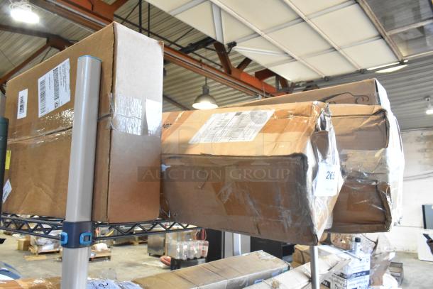 8 brand new GM 84162521 floor mat boxes, Denali floor mats, visible labels, stored on metal shelving.