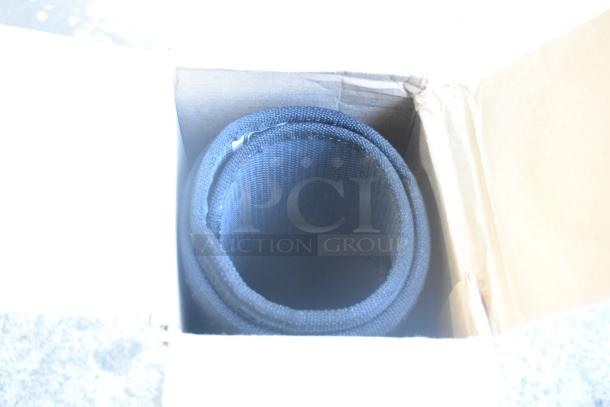 Box containing brand new GM 84162521 floor mat, rolled. Part of an 8-piece Denali floor mat set.