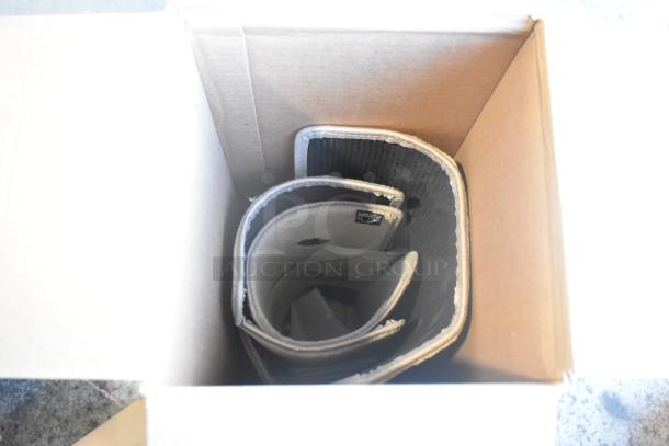 Box containing brand new GM 84162521 and Denali floor mats, neatly rolled inside, ideal for vehicle interior enhancement.
