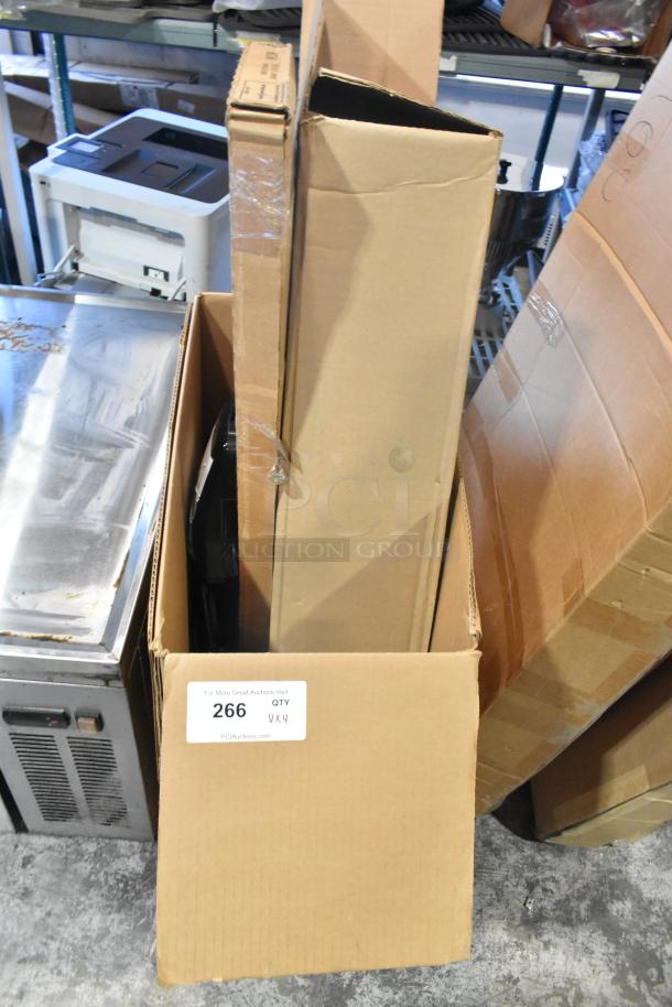 4 new items in cardboard boxes, including GM 19202164 window deflector and rain guard. Label indicates quantity 4, lot 266.