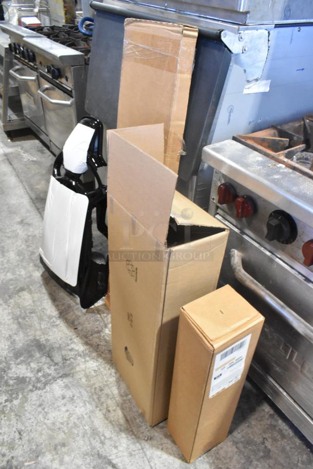 Four unopened boxes including GM 19202164 window deflector rain guard. Items are brand new, promising increased bid value.