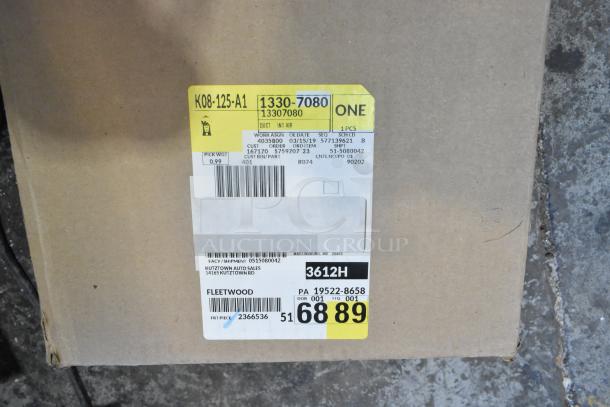 Box with shipping label indicating contents include four new GM 19202164 window deflector rain guards.