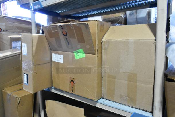 Closed cardboard boxes on shelves, labeled "270 QTY VRX" and "GM 22858829," indicating new GM car mats and various items.