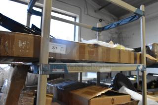 Shelving with boxed items, including a new 22389421 rail. Tag shows quantity 271. Boxes indicate new condition.