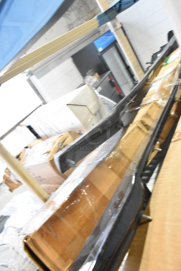 Four brand new boxed items, including the 22389421 rail, on a warehouse shelf. Items are sealed and in mint condition.