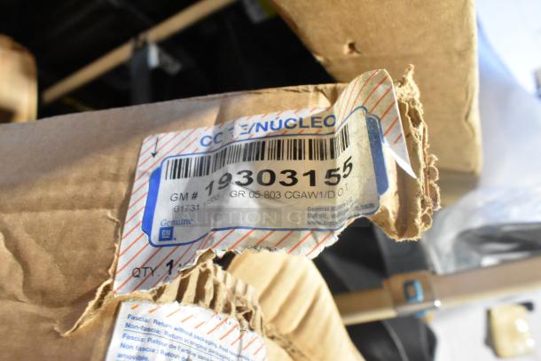 Box of 2 brand new GM 19303155 rims with label, indicating Genuine GM parts and part number for easy identification.
