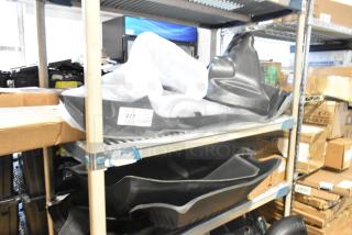 Two-tier lot with GM 22858823 car mats, GM 84449319 Chevrolet retractable cargo shade in jet black, brand new condition.