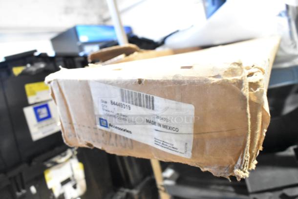 BRAND NEW GM 84449319 Chevrolet Retractable Cargo Shade, Jet Black, box labeled "Made in Mexico" with GM logo.