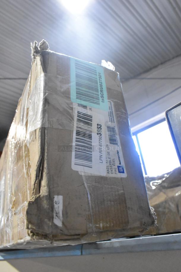 Cardboard box with item number 19171186, labeled "Footrack Assy," new condition, barcode and shipping labels visible.