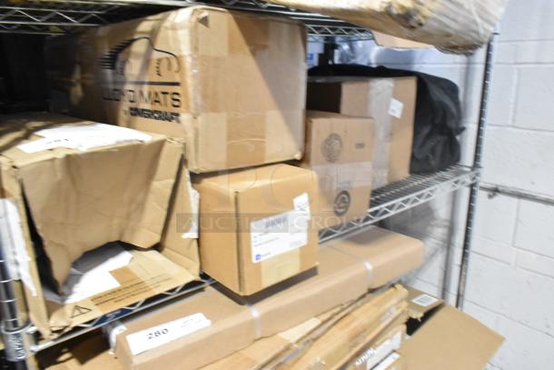 Tiered shelf with unopened boxes, including GM 84162521 new third row all-weather rubber floor mat in black.