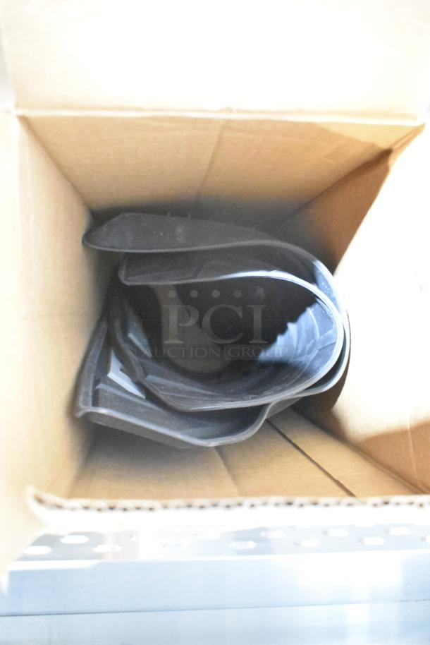 Box containing GM 84162521 new black third-row all-weather rubber floor mat, coiled. Condition: brand new; includes black bag.