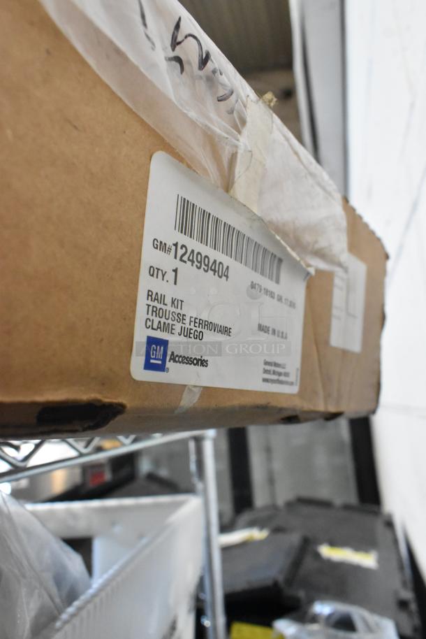GM 12499404 Rail Kit in box, labeled as GM Accessories. New condition. Includes Corvette Coupe Cargo.