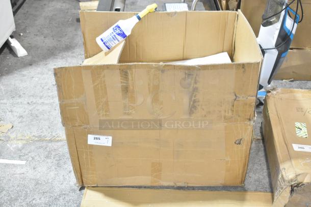 Cardboard box labeled "285" containing a brand new unit on casters. Box shows slight wear, unit condition unknown.