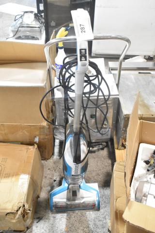 Bissell Multi Surface Brush Vacuum Cleaner, 115 Volts, 1 Phase, in good condition. Includes visible power cord and auction tag marked "287".