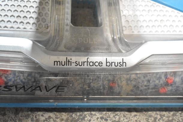Bissell Multi Surface Brush Vacuum, showing "multi-surface brush" label, 115V, 1 Phase, visible brush and pull tab feature.