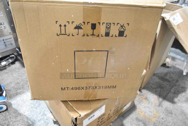 Cardboard box containing brand new motor, marked "MT:496X373X319MM." Packaging symbols indicate handling instructions.