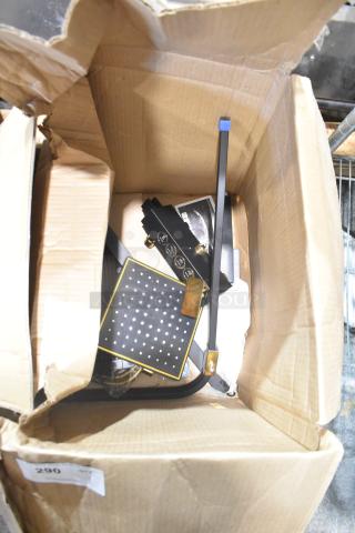 Brand new light fixture in open box, featuring LED panel and brass accents, perfect condition, ready for installation.