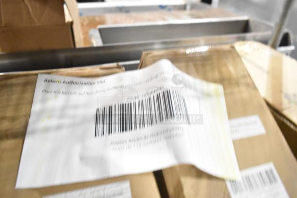 Three new cordless bamboo Roman shades in packaging, model LAZ-NoDrill-CORLESBAM-065 NN. Features easy installation.