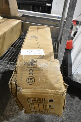 Brand new weed eater in original box with visible dents and scratches; CE and UKCA markings; auction label 294.