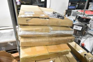 Stack of four new, scratch and dent 200-HG-ML-0221 bathroom storage cabinets in boxes. Boxes show wear.