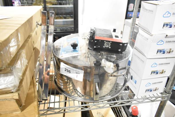 Brand new electric bud trimmer, 115 volts, 1 phase, visible scratches and dents, auction tag "296" attached.