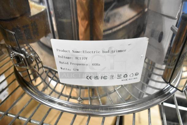 Brand new scratch and dent electric bud trimmer, 115 volts, single phase. Features label with specifications.