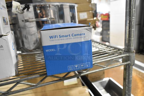 Blue and white box of a WiFi Smart Camera with visible dents. Box indicates real-time remote viewing. Model unspecified.