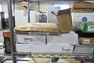 Boxes of scratch and dent items, including G1925-JD138637921 and G1925-D1135288649 faucets, shown on shelves.