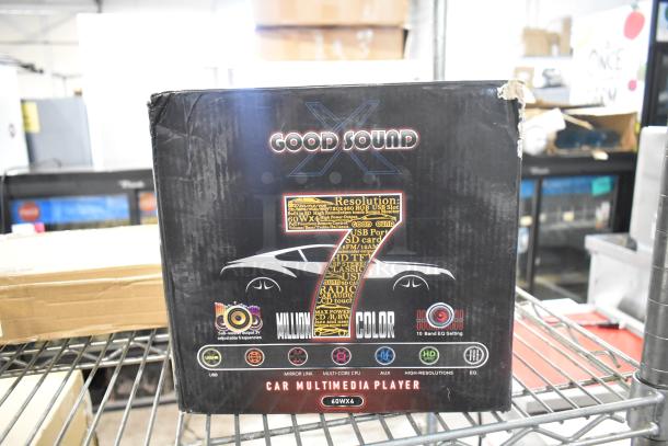Box of a Good Sound car multimedia player, 7-inch display, new condition, minor box damage visible.
